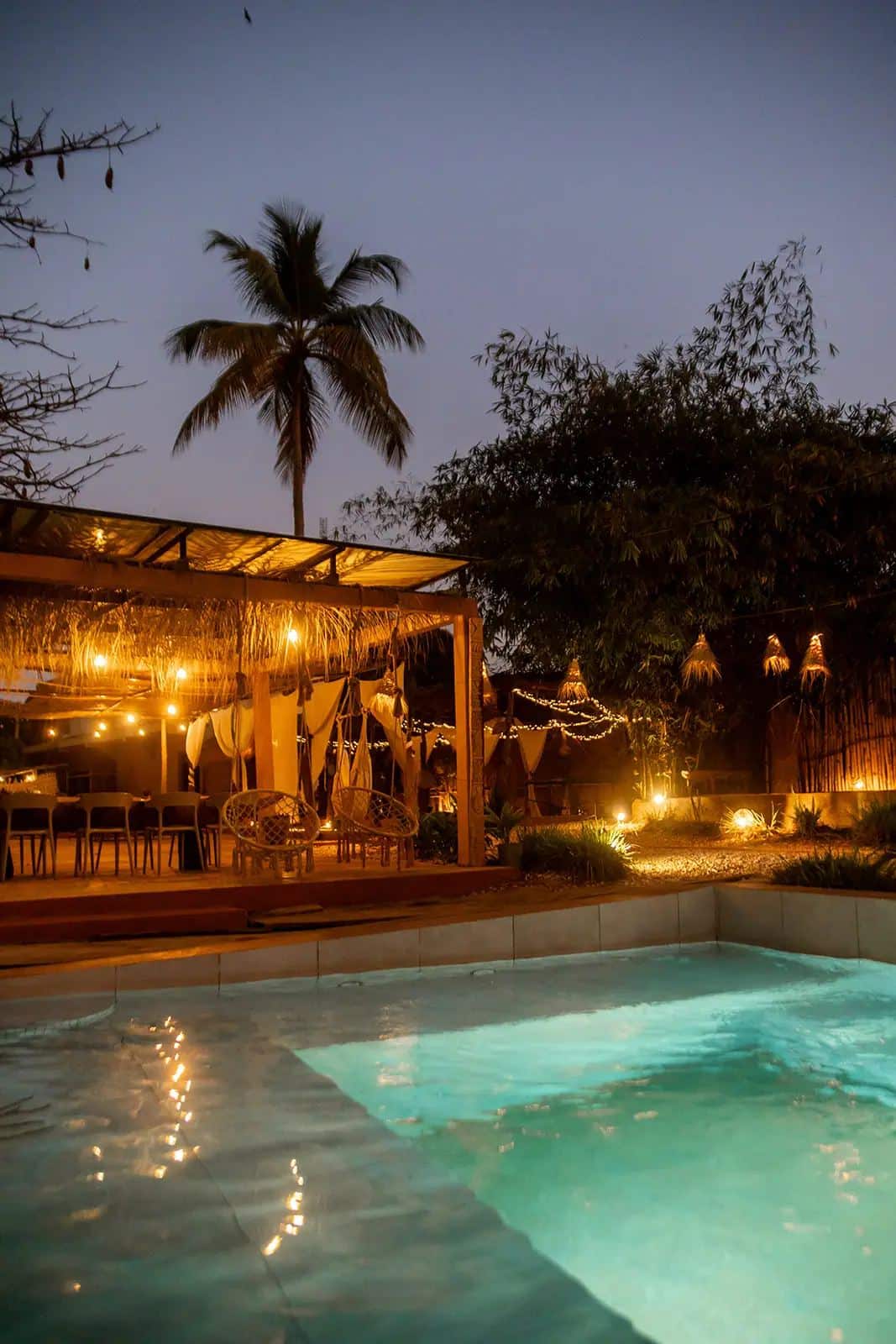 Pool reflections and warm lights at the lodge